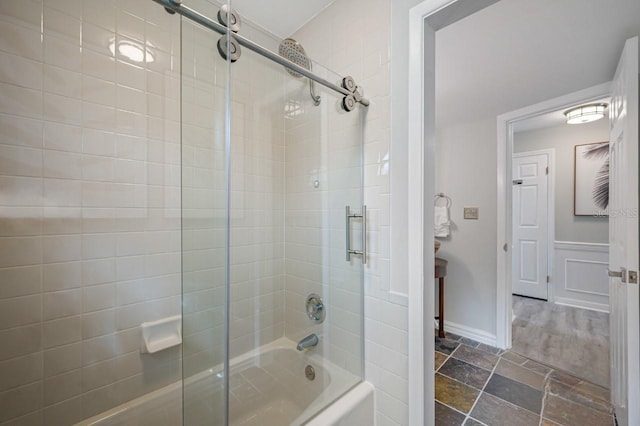 4545 Harbor Hills Dr, Largo, FL 33770 - full bathroom featuring bath / shower combo with glass door and stone finish floors