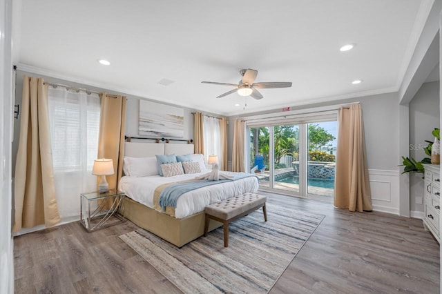 4545 Harbor Hills Dr, Largo, FL 33770 - bedroom featuring access to outside, crown molding, wood finished floors, wainscoting, and a decorative wall