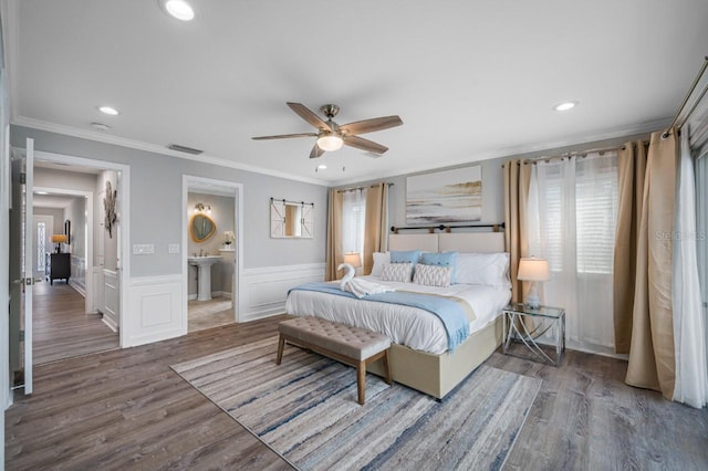 4545 Harbor Hills Dr, Largo, FL 33770 - bedroom with recessed lighting, wood finished floors, crown molding, a wainscoted wall, and ceiling fan