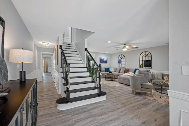 4545 Harbor Hills Dr, Largo, FL 33770 - stairway with wood finished floors, a ceiling fan, and recessed lighting