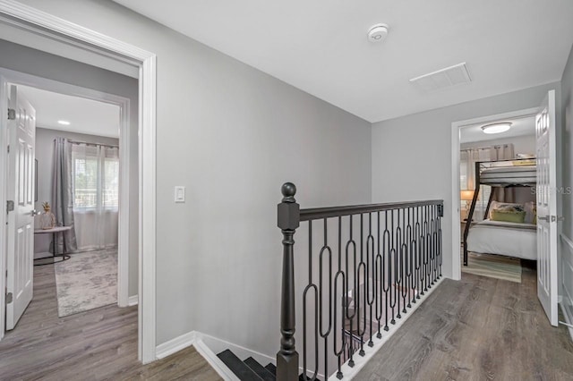 4545 Harbor Hills Dr, Largo, FL 33770 - corridor featuring an upstairs landing and wood finished floors