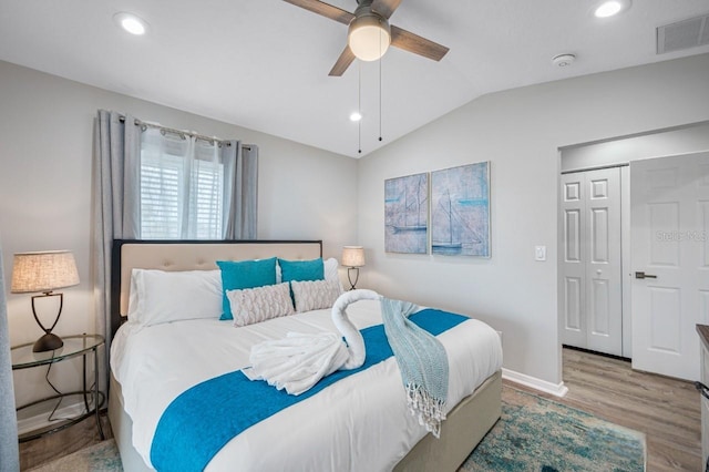 4545 Harbor Hills Dr, Largo, FL 33770 - bedroom featuring wood finished floors, lofted ceiling, recessed lighting, a ceiling fan, and a closet