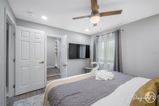 4545 Harbor Hills Dr, Largo, FL 33770 - bedroom with wood finished floors, ceiling fan, a spacious closet, and recessed lighting