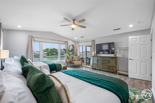 4545 Harbor Hills Dr, Largo, FL 33770 - bedroom with lofted ceiling, access to exterior, wood finished floors, a ceiling fan, and recessed lighting