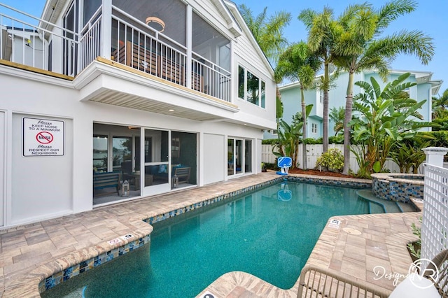 4545 Harbor Hills Dr, Largo, FL 33770 - view of pool featuring a pool with connected hot tub, a patio area, and a sunroom