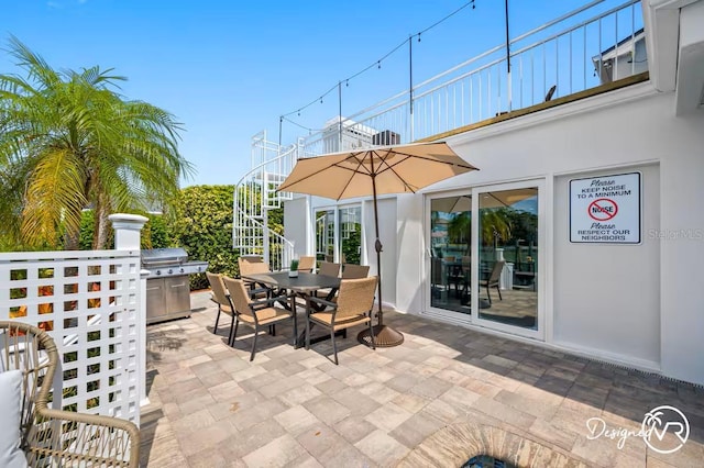 4545 Harbor Hills Dr, Largo, FL 33770 - view of patio / terrace with outdoor dining area and stairway