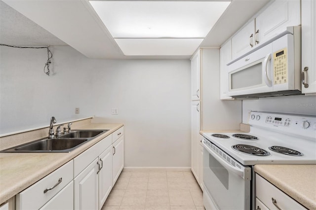 2617 Cove Cay Dr Unit 706, Clearwater, FL 33760 - kitchen featuring white appliances, white cabinetry, light countertops, and light tile patterned floors