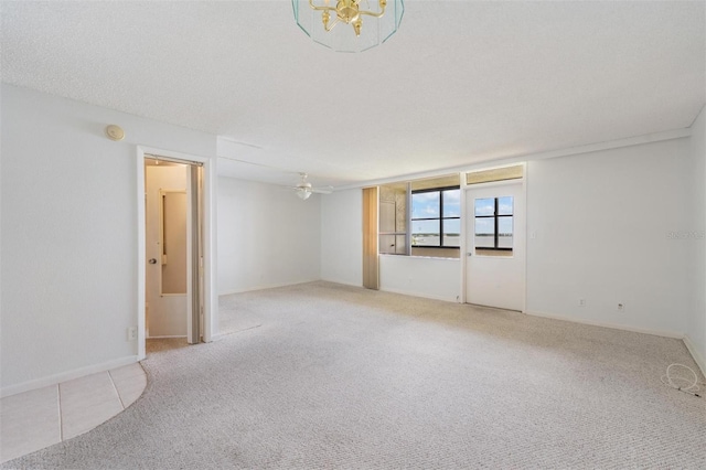 2617 Cove Cay Dr Unit 706, Clearwater, FL 33760 - carpeted spare room featuring a chandelier, a smoke detector, and ceiling fan