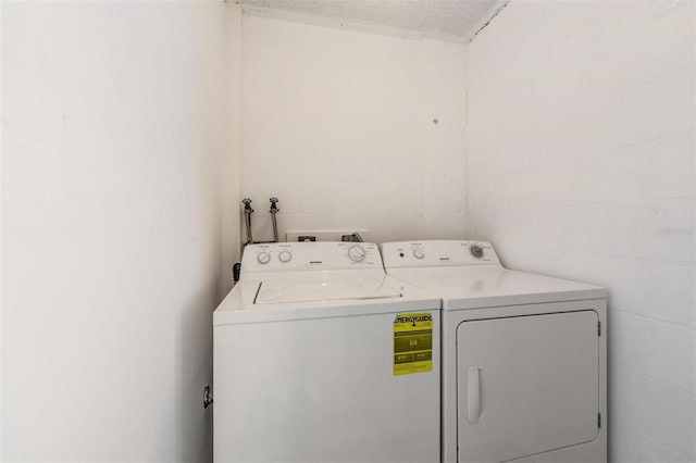 2617 Cove Cay Dr Unit 706, Clearwater, FL 33760 - washroom with washer and dryer and concrete block wall