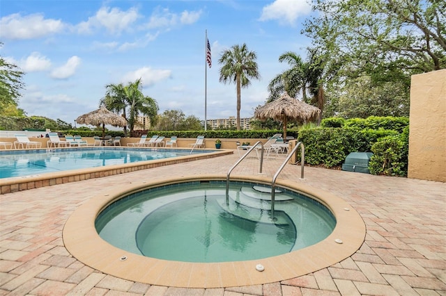 2617 Cove Cay Dr Unit 706, Clearwater, FL 33760 - community pool featuring a patio and a hot tub