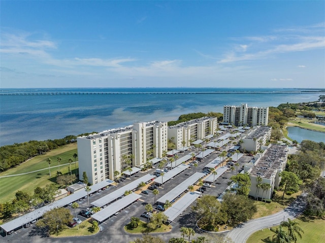 2617 Cove Cay Dr Unit 706, Clearwater, FL 33760 - drone / aerial view of a large body of water and a golf course
