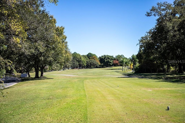 2617 Cove Cay Dr Unit 706, Clearwater, FL 33760 - view of property's community featuring view of scattered trees, a yard, and view of golf course