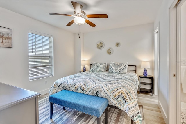 15305 1st St E Unit 305, Madeira Beach, FL 33708 - bedroom with light wood-style floors and a ceiling fan