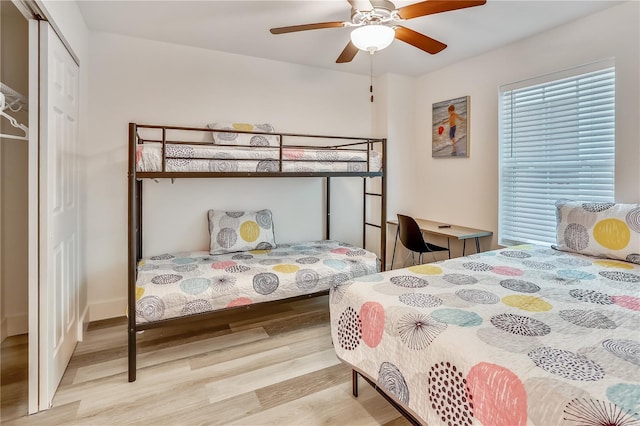 15305 1st St E Unit 305, Madeira Beach, FL 33708 - bedroom featuring wood finished floors, a closet, and ceiling fan