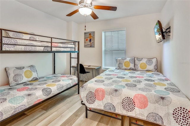 15305 1st St E Unit 305, Madeira Beach, FL 33708 - bedroom with wood finished floors and a ceiling fan
