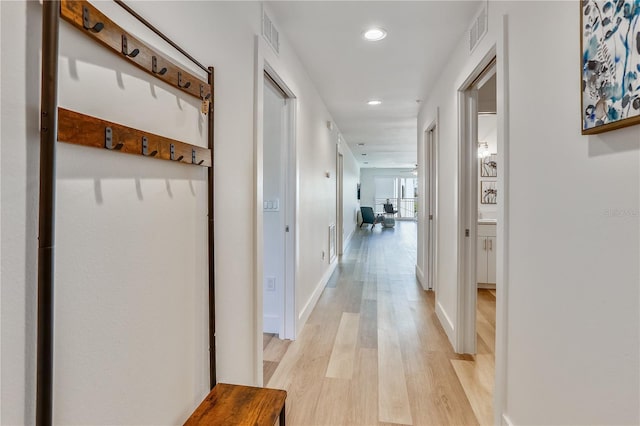 15305 1st St E Unit 305, Madeira Beach, FL 33708 - hallway with light wood-style floors and recessed lighting