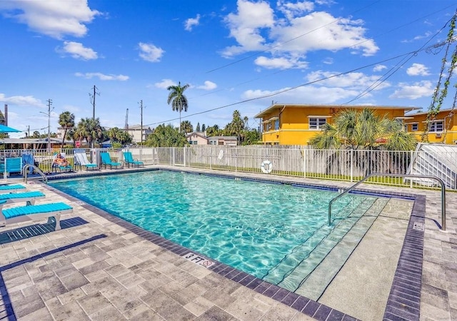 15305 1st St E Unit 305, Madeira Beach, FL 33708 - community pool featuring a patio
