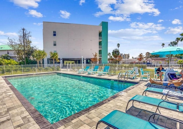 15305 1st St E Unit 305, Madeira Beach, FL 33708 - community pool featuring a patio