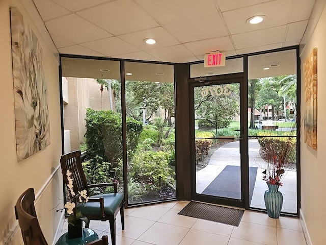 3076 Eastland Blvd Unit 210, Clearwater, FL 33761 - doorway to outside featuring plenty of natural light, a paneled ceiling, and light tile patterned floors