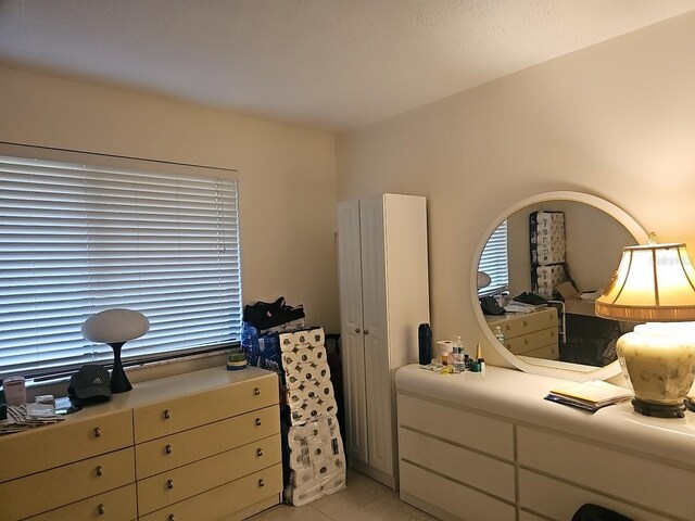 3076 Eastland Blvd Unit 210, Clearwater, FL 33761 - bedroom featuring light tile patterned flooring