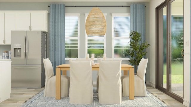 7534 E 117th Ln, Palmetto, FL 34221 - dining room with light wood finished floors