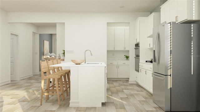 7534 E 117th Ln, Palmetto, FL 34221 - kitchen with stainless steel fridge with ice dispenser, light wood-style flooring, a kitchen breakfast bar, white cabinetry, and light countertops