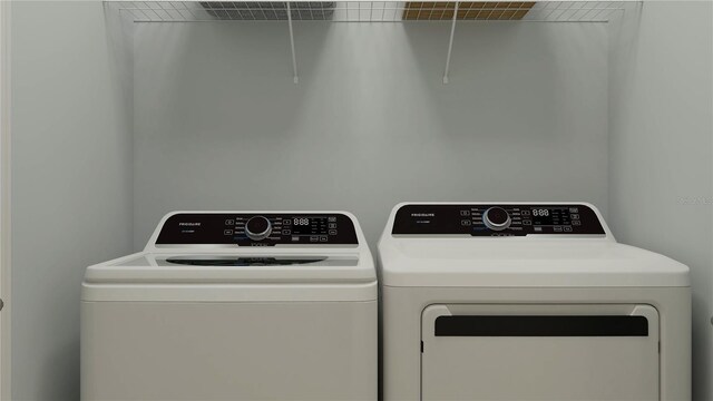 7534 E 117th Ln, Palmetto, FL 34221 - laundry room with washer and clothes dryer