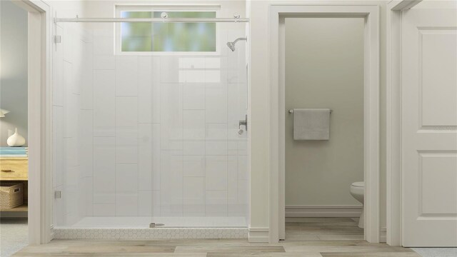 7534 E 117th Ln, Palmetto, FL 34221 - bathroom featuring a stall shower and wood finished floors
