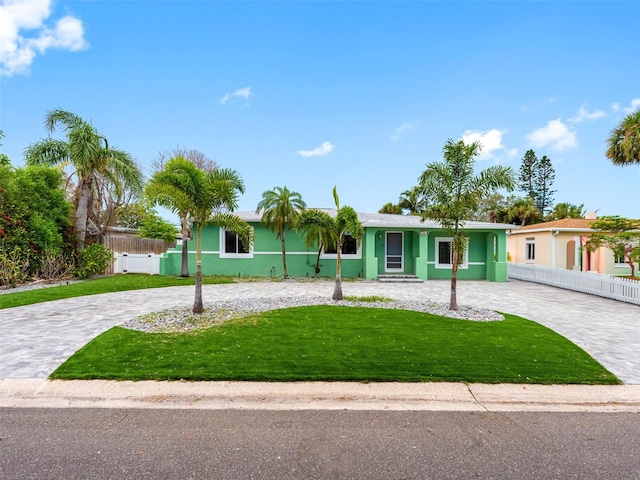 540 80th Ave, St Pete Beach, FL 33706 - ranch-style home featuring curved driveway and stucco siding