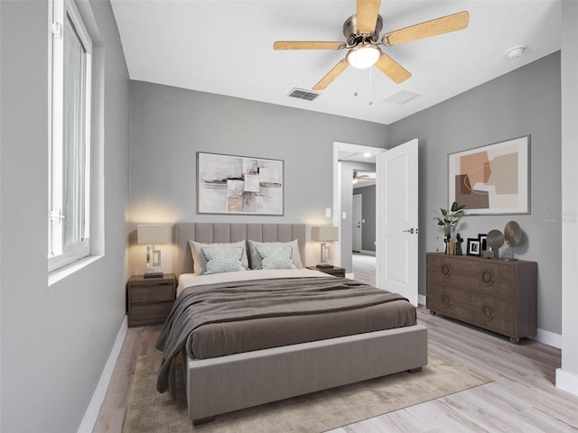 540 80th Ave, St Pete Beach, FL 33706 - bedroom with wood finished floors and a ceiling fan