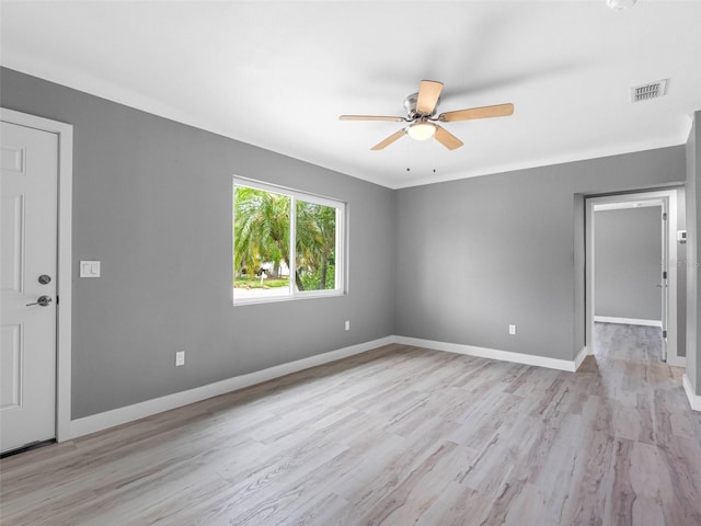 540 80th Ave, St Pete Beach, FL 33706 - empty room with a ceiling fan and light wood-style floors