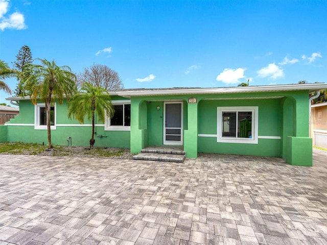 540 80th Ave, St Pete Beach, FL 33706 - single story home featuring stucco siding and a patio