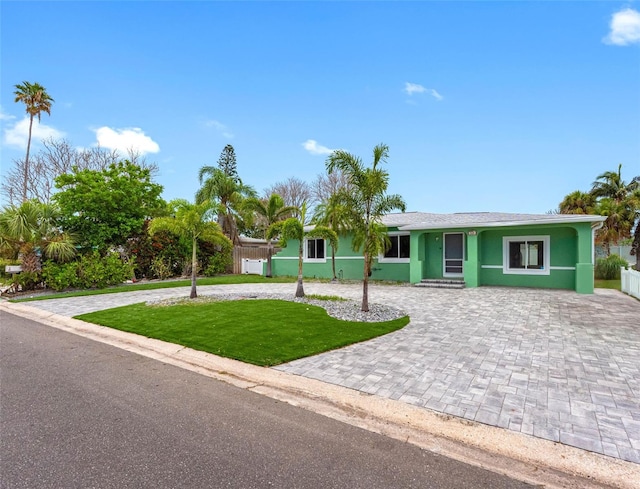 540 80th Ave, St Pete Beach, FL 33706 - single story home with curved driveway and stucco siding