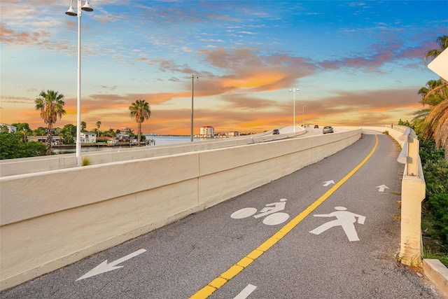540 80th Ave, St Pete Beach, FL 33706 - view of asphalt street with a water view and street lighting