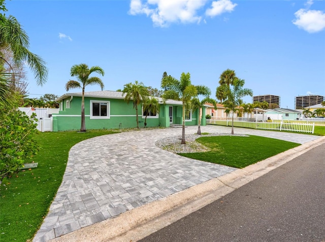 540 80th Ave, St Pete Beach, FL 33706 - single story home with curved driveway and stucco siding