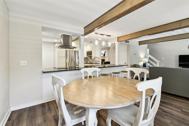 12835 74th Ave, Seminole, FL 33776 - dining room featuring dark wood-style floors, beam ceiling, and recessed lighting