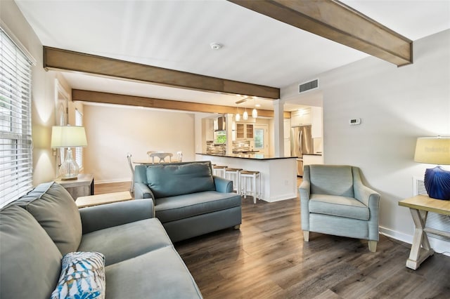 12835 74th Ave, Seminole, FL 33776 - living room featuring beamed ceiling and dark wood-style floors