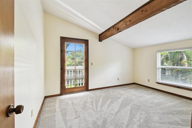 12835 74th Ave, Seminole, FL 33776 - empty room with healthy amount of natural light, carpet floors, and a textured ceiling
