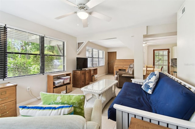 12835 74th Ave, Seminole, FL 33776 - living room with ceiling fan and healthy amount of natural light