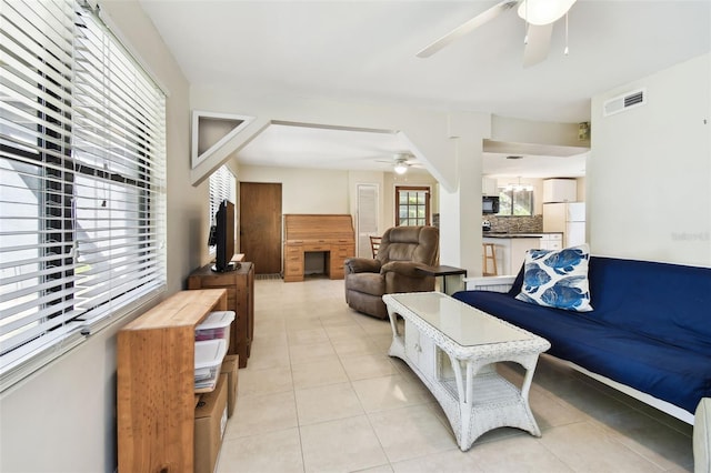 12835 74th Ave, Seminole, FL 33776 - living area with a ceiling fan and light tile patterned flooring
