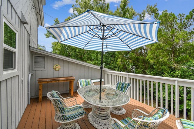 12835 74th Ave, Seminole, FL 33776 - wooden terrace featuring outdoor dining space