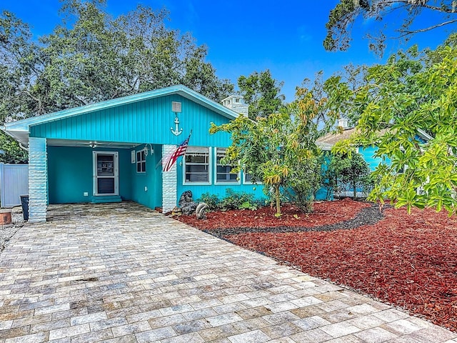 6428 Old Main St, New Port Richey, FL 34653 - view of front of house featuring decorative driveway and an attached carport