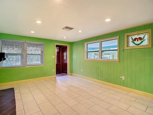 6428 Old Main St, New Port Richey, FL 34653 - spare room featuring baseboards and recessed lighting