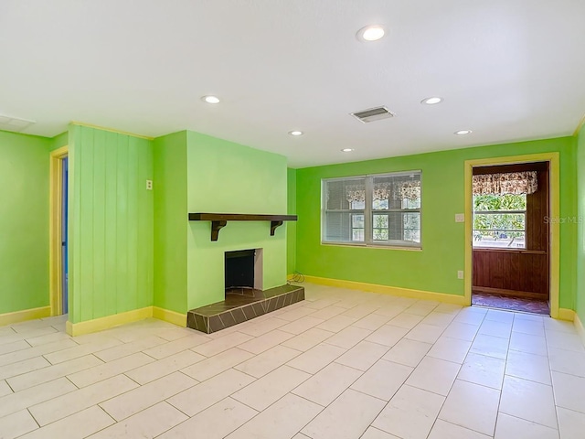 6428 Old Main St, New Port Richey, FL 34653 - unfurnished living room featuring a fireplace, recessed lighting, and tile patterned floors