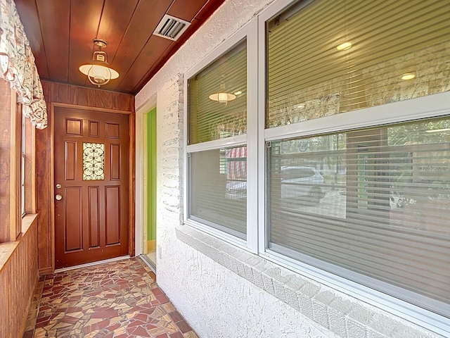 6428 Old Main St, New Port Richey, FL 34653 - doorway to property featuring a porch