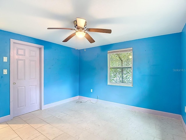 6428 Old Main St, New Port Richey, FL 34653 - empty room featuring a ceiling fan and baseboards