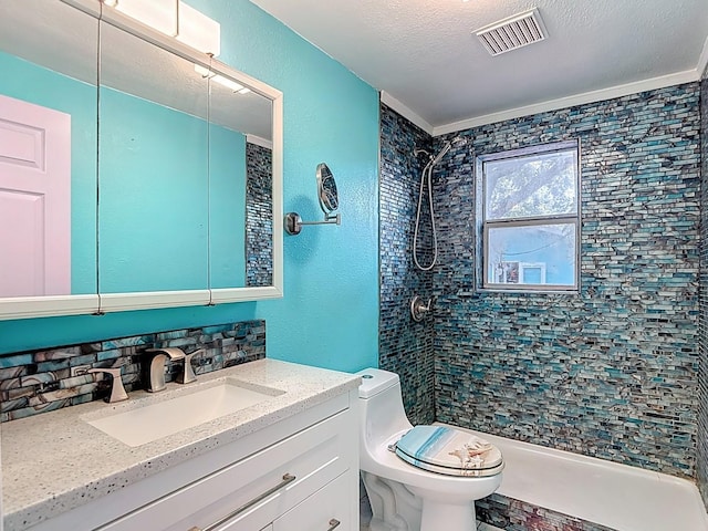 6428 Old Main St, New Port Richey, FL 34653 - full bathroom with tiled shower, vanity, a textured ceiling, and a textured wall