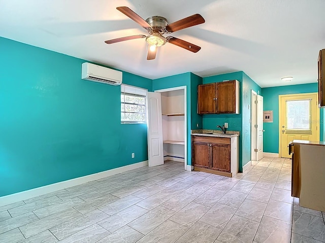 6428 Old Main St, New Port Richey, FL 34653 - kitchen with a wall mounted AC and a ceiling fan