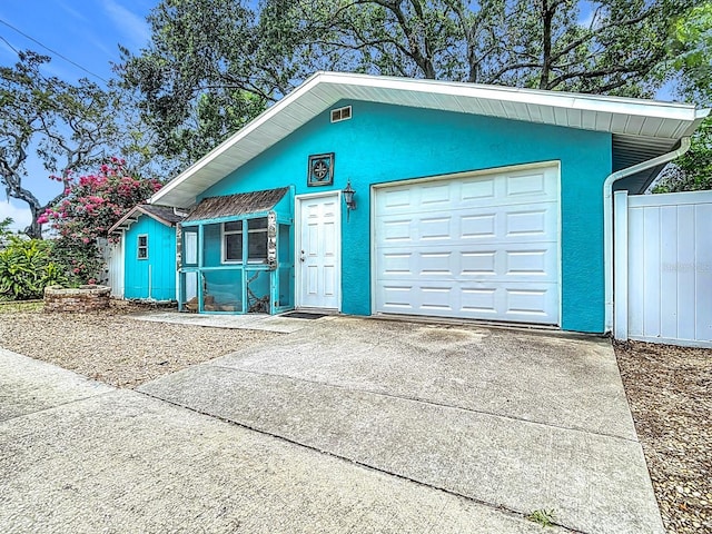 6428 Old Main St, New Port Richey, FL 34653 - garage featuring concrete driveway