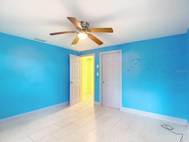 6428 Old Main St, New Port Richey, FL 34653 - unfurnished room with ceiling fan and baseboards